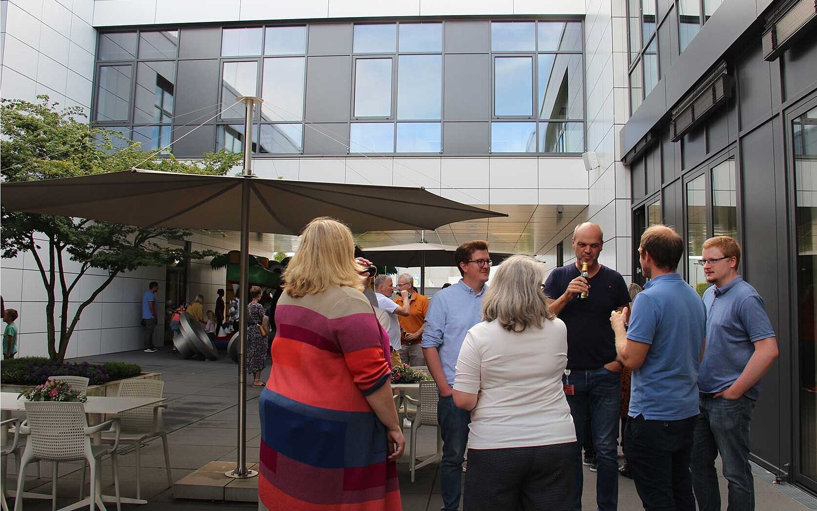 Group of people talking in an inner courtyard