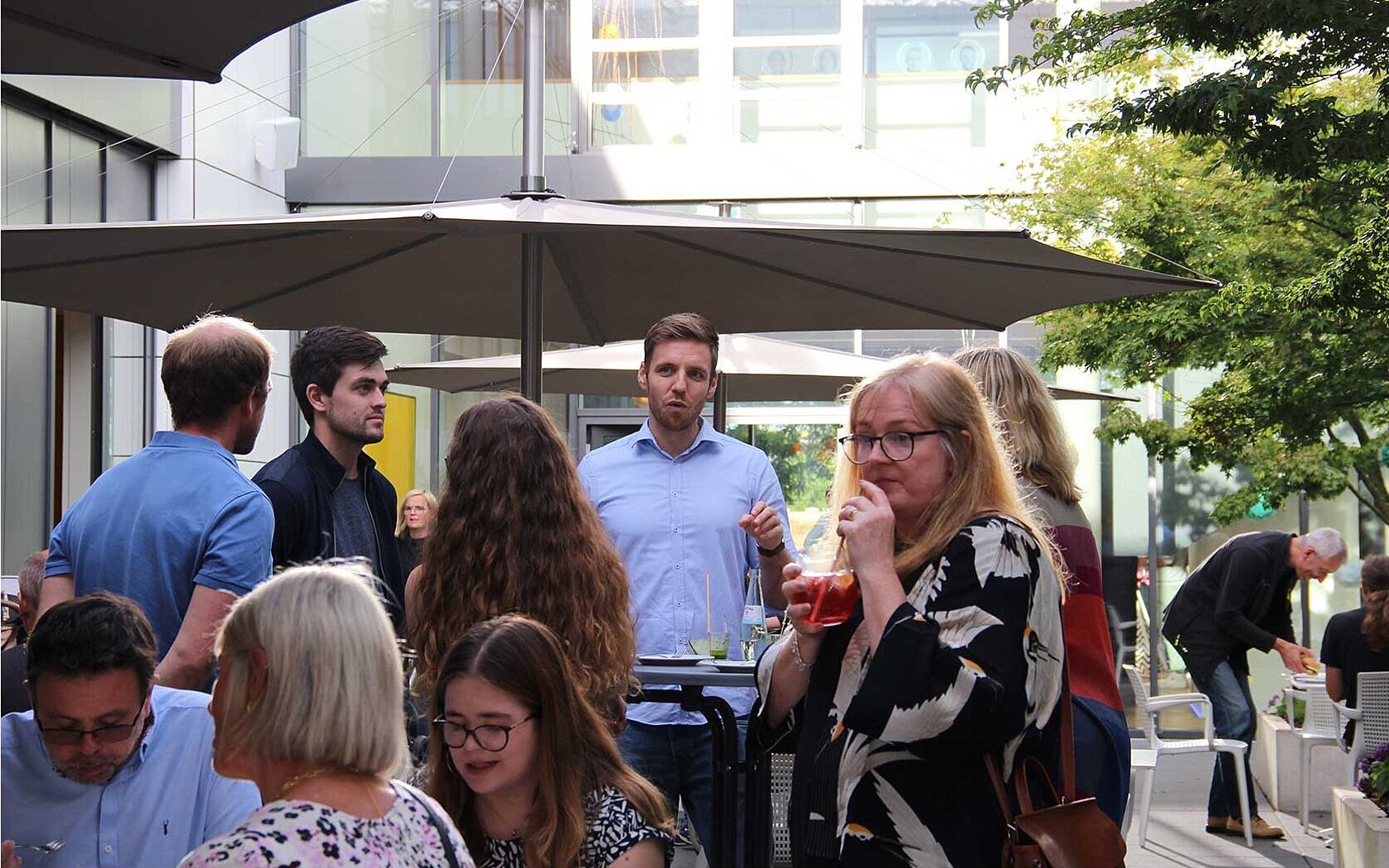 Group of people talking in an inner courtyard