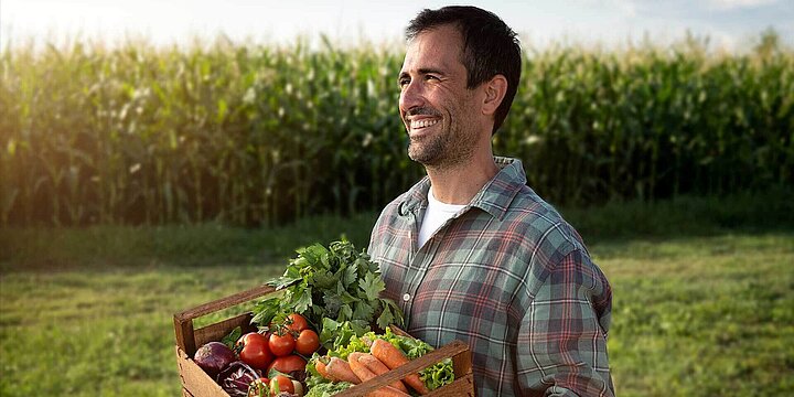 Farmer with organic vegetables in the field