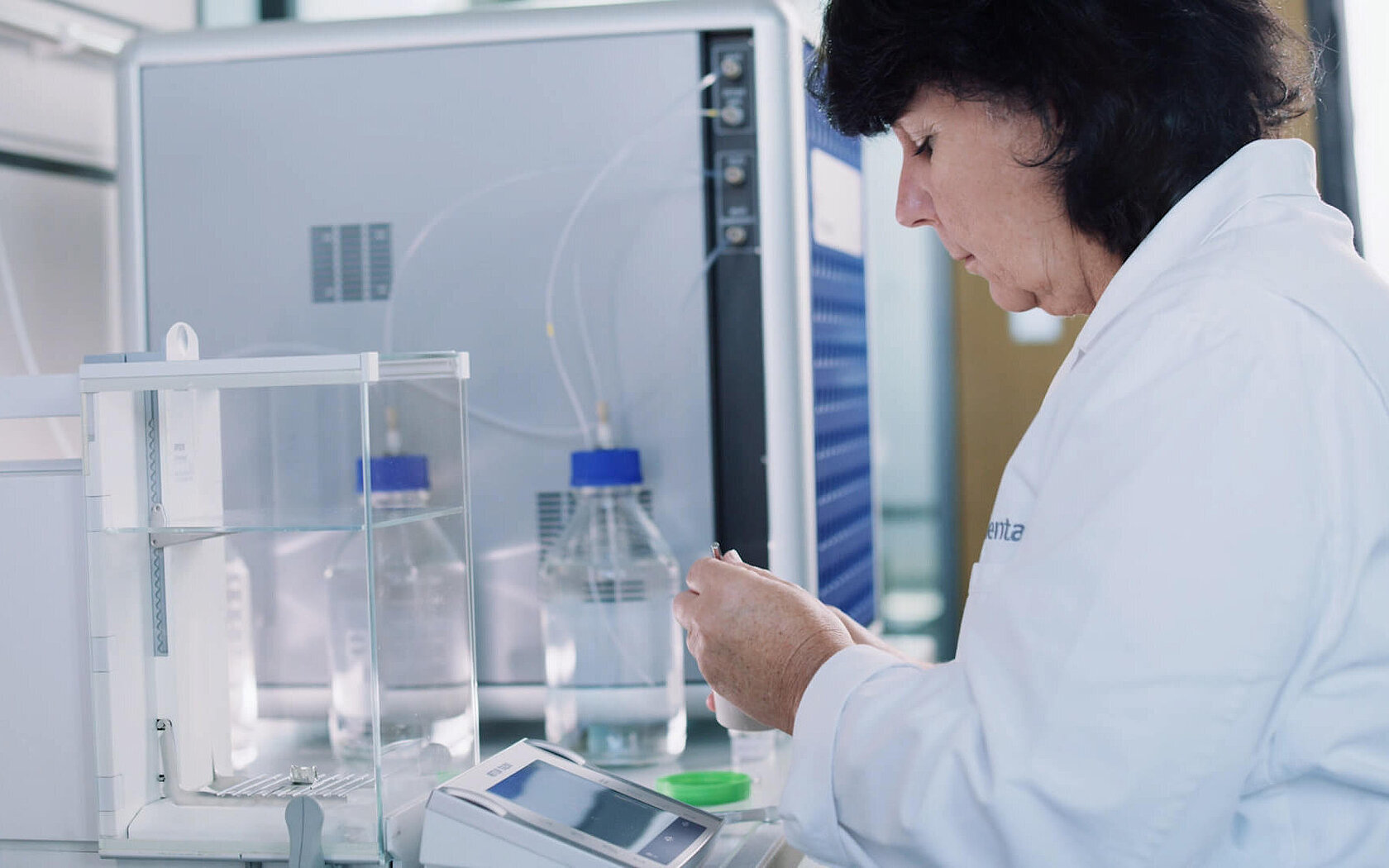 Woman weighing samples in a laboratory