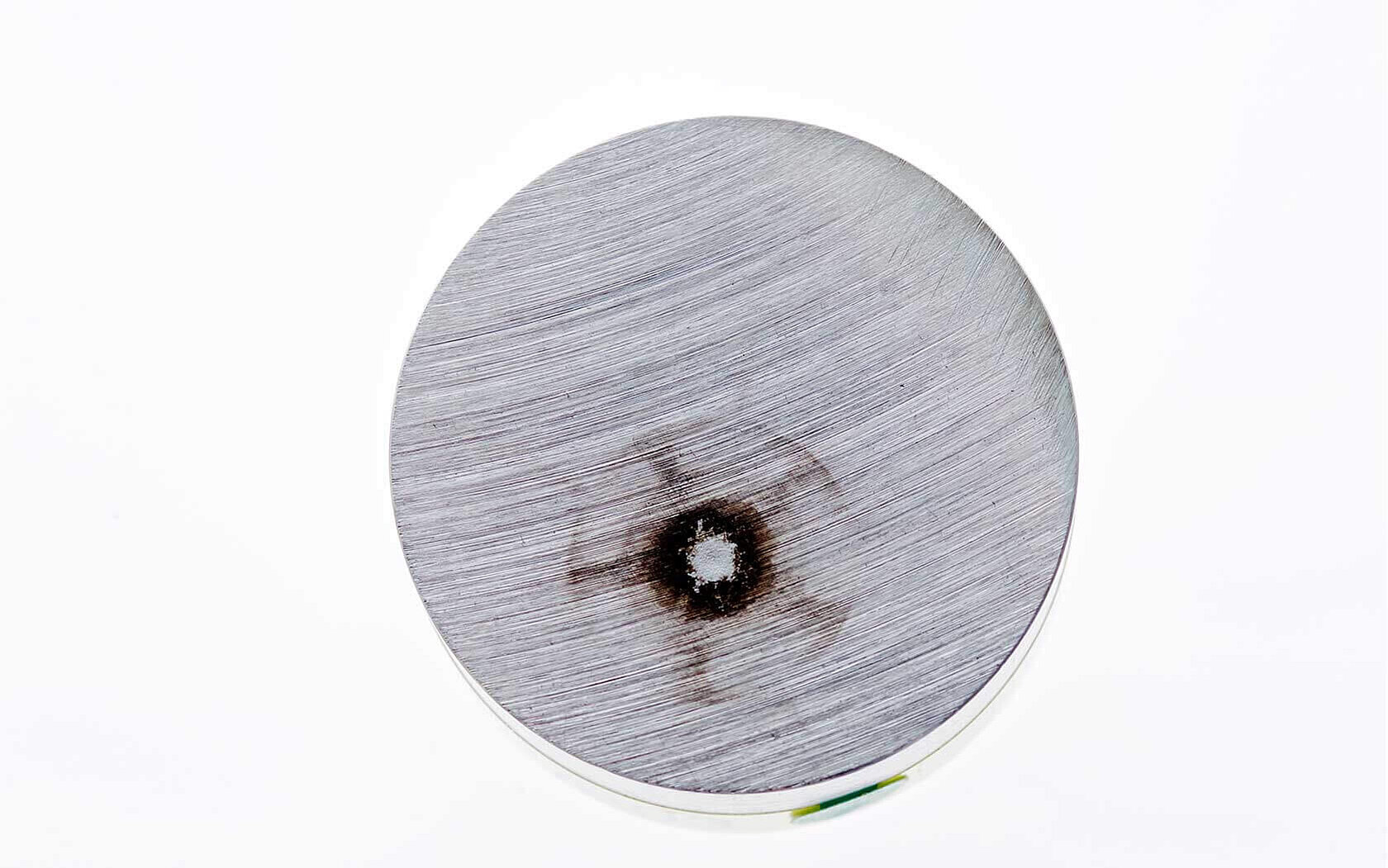 Burn mark on a metallic sample