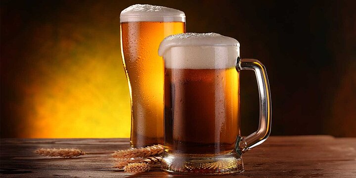 2 beer mugs with beer