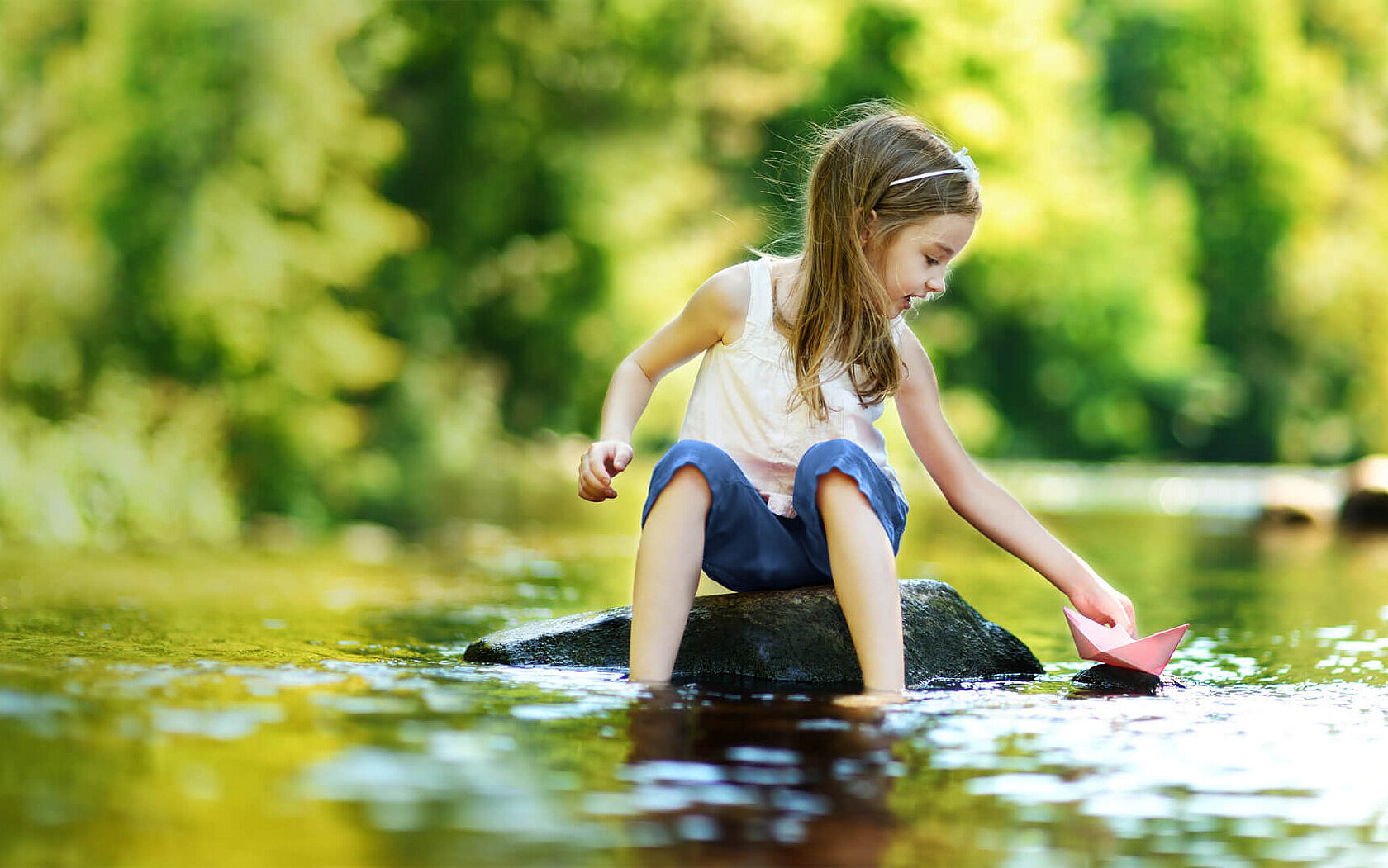 Girl playing at the water