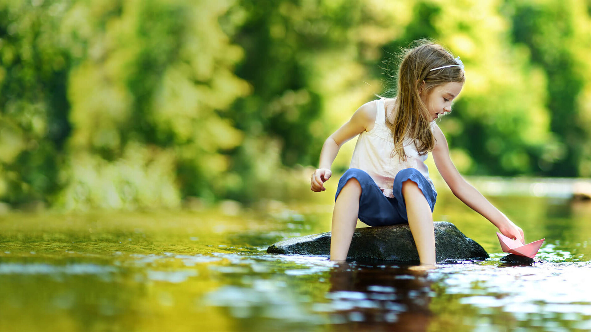 Girl playing at the water